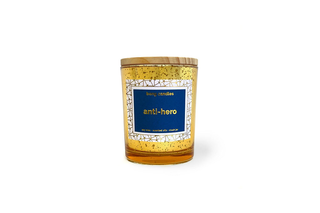 A gold glass candle with a label that reads 'anti-hero' for swifties, Taylor swift candle, gifts for the swiftie