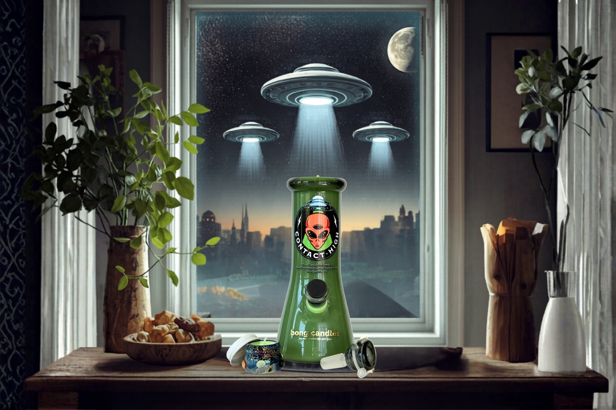 Green contact high bong candle with skull design on a table in front of a window with UFOs and cityscape.